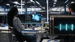 Data center system administrator working on neural network software development. African american woman in server room implementing machine learning technology using PC, camera A - Powered by Shutterstock - Get 15% off with code: PIKWIZARD15