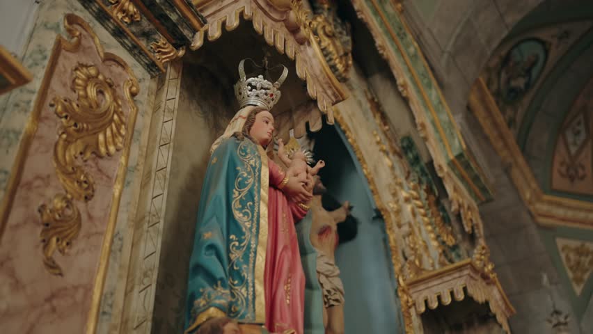 baroque religious altar with crowned virgin mary and child statue in church