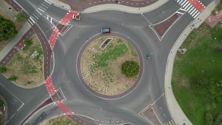 Static Drone Shot of Busy Roundabout in Daylight – Original Footage Without Color Correction