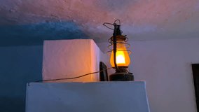 Burning lantern illuminating a white interior in the dark - Powered by Shutterstock - Get 15% off with code: PIKWIZARD15