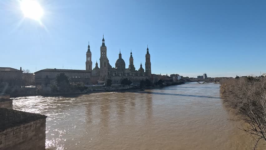 Basilica of Our Lady of the Pillar Along the Ebro River Viewed from Puente de Piedra on a Clear Winter Day in Zaragoza Spain