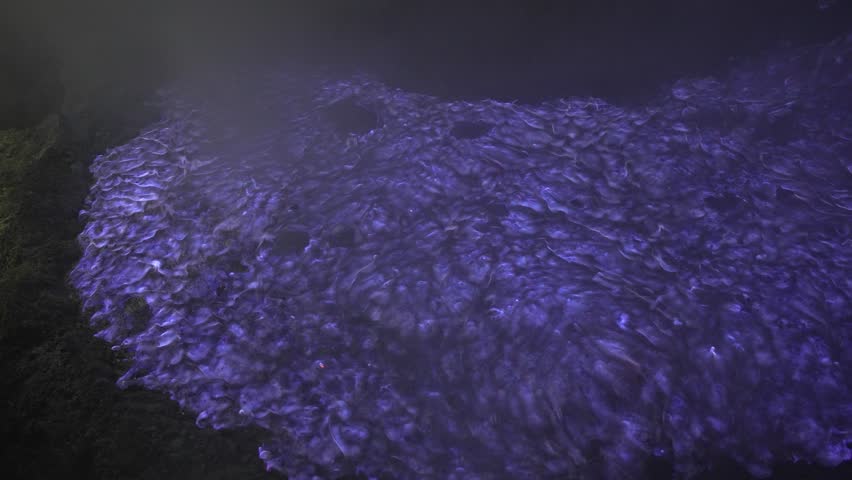 Close up shot of the famous blue flame phenomenon at Kawah Ijen volcano crater.