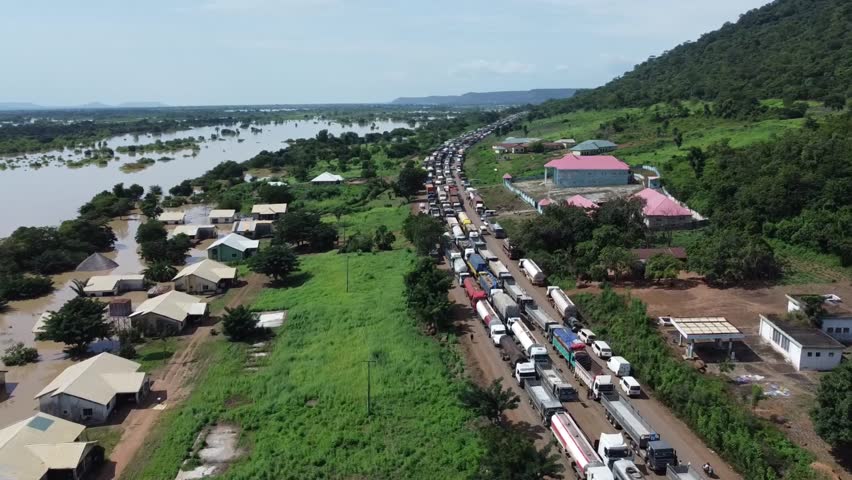 An overwhelming view of thousands of trucks stuck in a massive traffic jam, highlighting the impact of road congestion on logistics, economy, and everyday life in Nigeria.