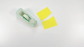 taping up two pieces of torn paper with sticky tape, view from above on white surface - Powered by Shutterstock - Get 15% off with code: PIKWIZARD15