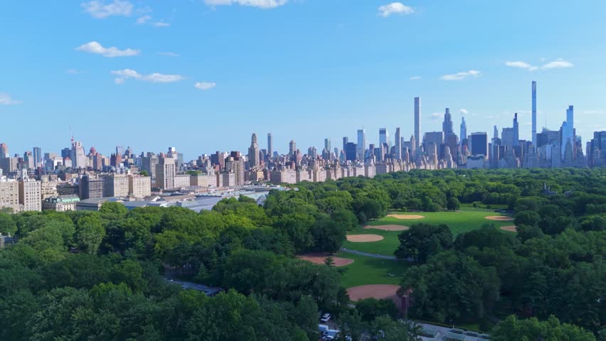 Aerial over central park in New York with famous nyc skyline and skyscrapers