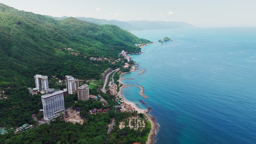 Drone revealing the charm of Puerto Vallarta, Mexico, exotic beaches, and mountains