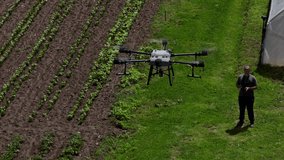 An agricultural drone monitors crop rows in a scenic mountain valley, showcasing smart farming, precision agriculture, and innovative technology for sustainable growth and efficient crop management - Powered by Shutterstock - Get 15% off with code: PIKWIZARD15