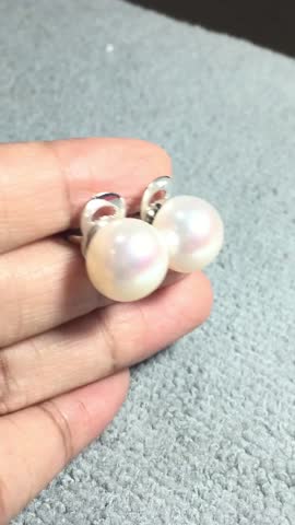 Elegant Extra Large White Pearl Earrings with Silver Stud Backing on Hand