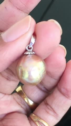 Beautiful Natural Pearl Pendant Hanging from Elegant Silver Setting