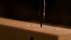 Close-Up of Drill Bit Boring into Wood in 4K Ultra HD – Carpentry and DIY Construction Scene - Powered by Shutterstock - Get 15% off with code: PIKWIZARD15