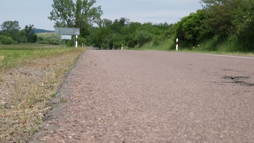 Heat haze rising from rural asphalt road in summer