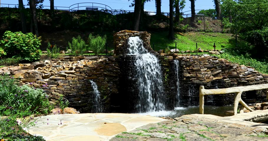 Static video of a waterfall in the Old Mill in Little Rock, Arkansas. Several small waterfalls feed into a small creek.