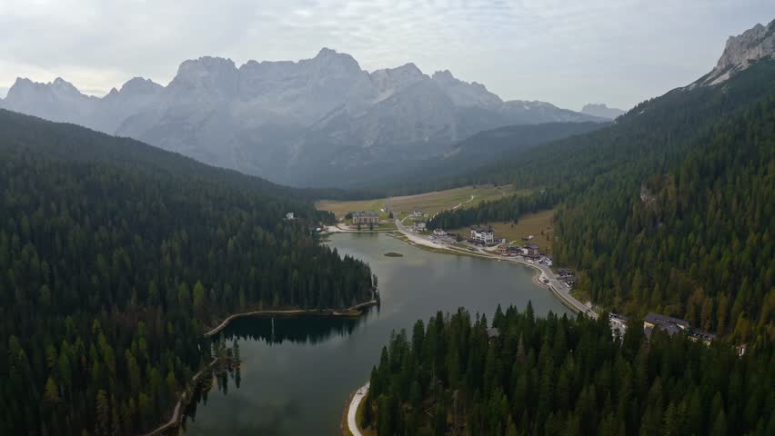 Aerial view of Lago di Misurina, a picturesque lake reflecting the surrounding mountains and forests, creating a serene landscape, Auronzo di Cadore, Veneto, Italy.