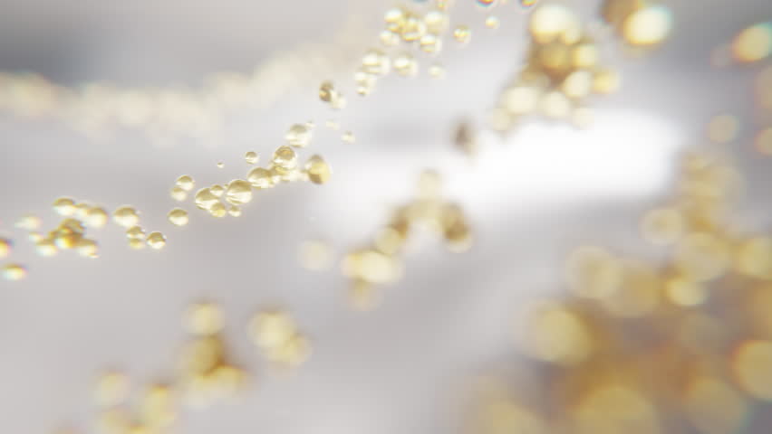 Macro shot of glowing collagen softgel capsules. Perfect for skincare, cosmetic, and supplement concepts. Shiny texture, transparent golden beads, luxurious and clean look.