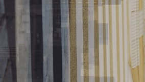 A person is crossing the road on a sunny day. Financial graphs and data are superimposed on the scene, representing the global economy. - Powered by Shutterstock - Get 15% off with code: PIKWIZARD15