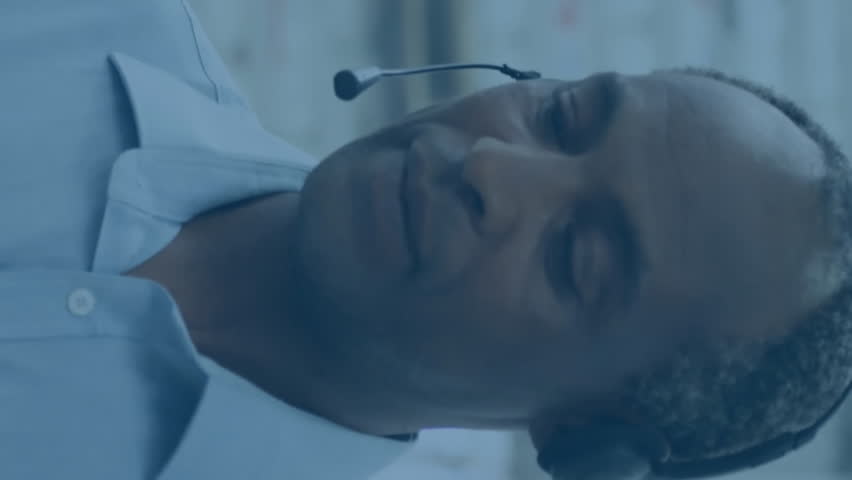 Customer service representative with headset, data processing animation over warehouse background. Customer support, call center, help desk, communication, logistics, technology - Powered by Shutterstock - Get 15% off with code: PIKWIZARD15