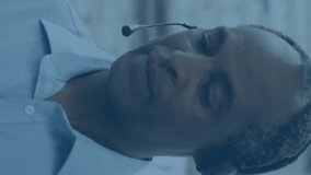 Customer service representative with headset, data processing animation over warehouse background. Customer support, call center, help desk, communication, logistics, technology - Powered by Shutterstock - Get 15% off with code: PIKWIZARD15