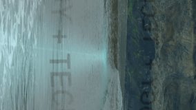 Tech animation overlaying waves on rocky beach, showcasing technology integration. innovation, futuristic, digital, nature, seaside - Powered by Shutterstock - Get 15% off with code: PIKWIZARD15