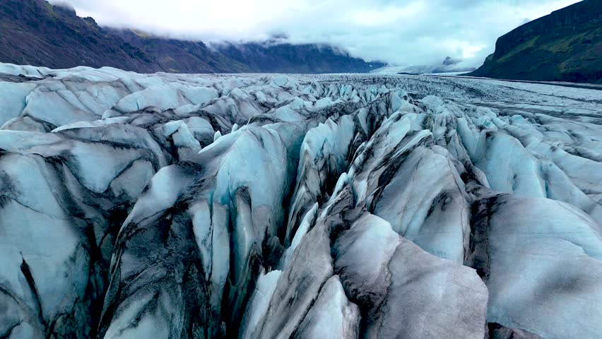 Explore the stunning formations of Skaftafell Glacier, characterized by intricate crevasses and breathtaking ice structures. Witness the dramatic beauty of Icelands natural wonders.