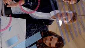 Animation of infographic interface over diverse coworkers discussing reports on laptop. Digital composite, multiple exposure, business, progress, planning, teamwork, global and technology concept. - Powered by Shutterstock - Get 15% off with code: PIKWIZARD15