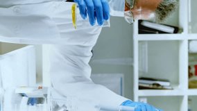 Animation of chemical formulas over caucasian senior male lab worker with sample. science, chemistry and medicine concept digitally generated video. - Powered by Shutterstock - Get 15% off with code: PIKWIZARD15