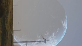 Animation of data processing and globe over wind turbines. global business and digital interface concept digitally generated video. - Powered by Shutterstock - Get 15% off with code: PIKWIZARD15