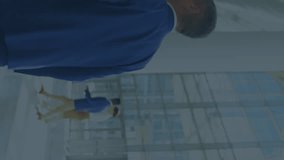 Animation of financial data over caucaian businessmen walking in office. Global economy, finance, business and technology concept digitally generated video. - Powered by Shutterstock - Get 15% off with code: PIKWIZARD15