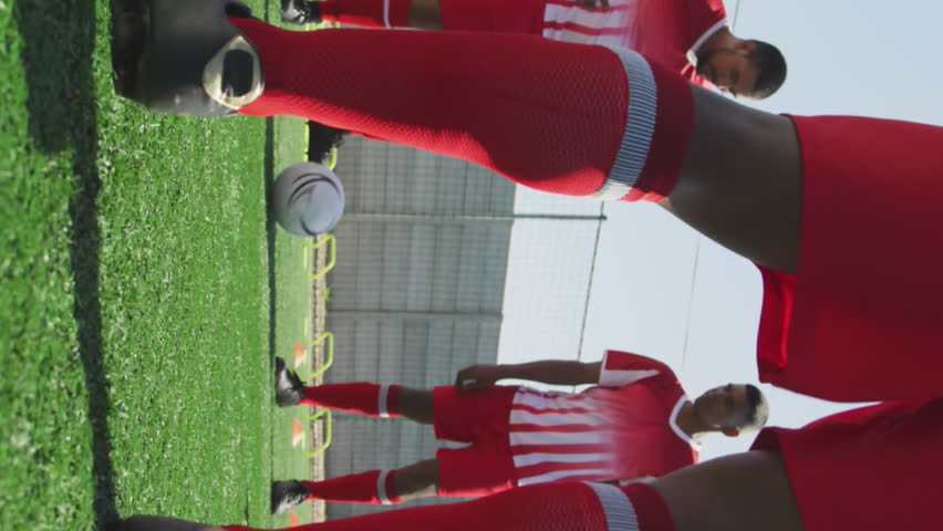 Animation of social media icons over team of diverse male soccer players training on sports field. Social media networking and sports fitness concept - Powered by Shutterstock - Get 15% off with code: PIKWIZARD15