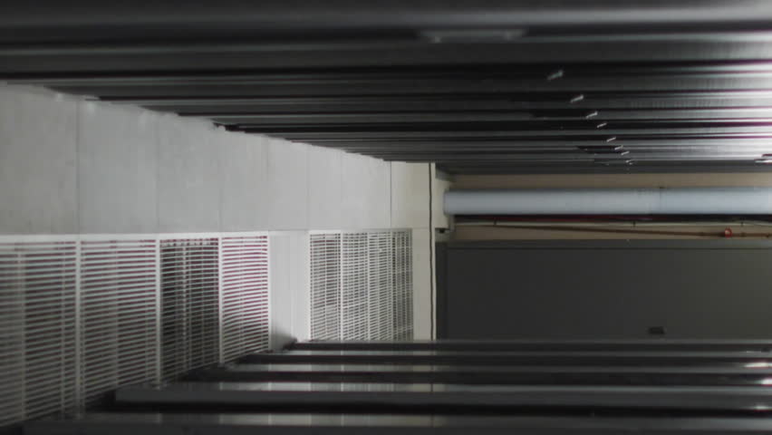 Animation of screens with programming language moving over data server racks. Digital composite, networking, data center, security, technology, network server, coding, data processing. - Powered by Shutterstock - Get 15% off with code: PIKWIZARD15