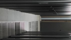 Animation of screens with programming language moving over data server racks. Digital composite, networking, data center, security, technology, network server, coding, data processing. - Powered by Shutterstock - Get 15% off with code: PIKWIZARD15