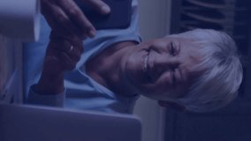 In kitchen, elderly woman using smartphone with animation of data analytics graphics. Technology, innovation, senior, digital, statistics, interaction - Powered by Shutterstock - Get 15% off with code: PIKWIZARD15