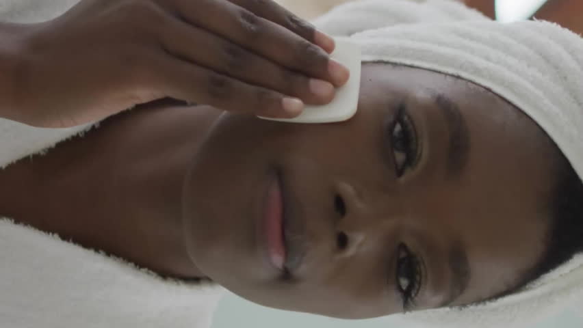 Applying skincare product, woman with 6G technology animation overlay in background. innovation, digital, futuristic, wellness, beauty, advancement - Powered by Shutterstock - Get 15% off with code: PIKWIZARD15