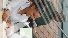 Discussing documents, diverse team in office with data processing animation overlay. Collaboration, teamwork, diversity, brainstorming, analysis, business - Powered by Shutterstock - Get 15% off with code: PIKWIZARD15