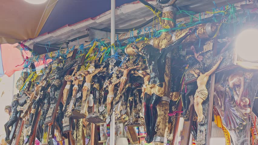 Close-up shot. Stalls selling religious souvenirs at the Basilica of the Black Christ in Equipulas.