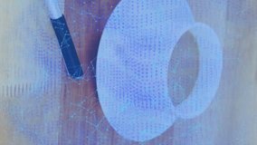 Animation of security padlock and chain icon over digital tablet, pen and coffee cup on wooden table. Cyber security and business technology concept - Powered by Shutterstock - Get 15% off with code: PIKWIZARD15