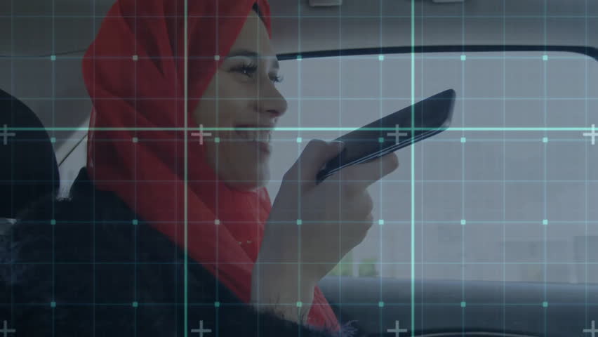 Passenger lifting smartphone in car, issuing voice command for navigation as grid overlay sweeping. Technology, innovation, mobility, interior, casual, communication, modern - Powered by Shutterstock - Get 15% off with code: PIKWIZARD15