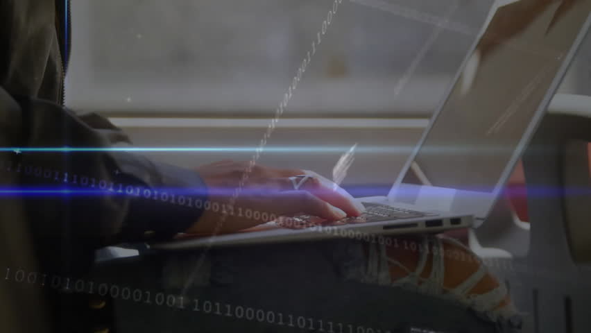 Software developer typing on laptop keyboard activating binary and code overlays for live analysis. Technology, programming, innovation, digital, cyber, focus, workspace - Powered by Shutterstock - Get 15% off with code: PIKWIZARD15