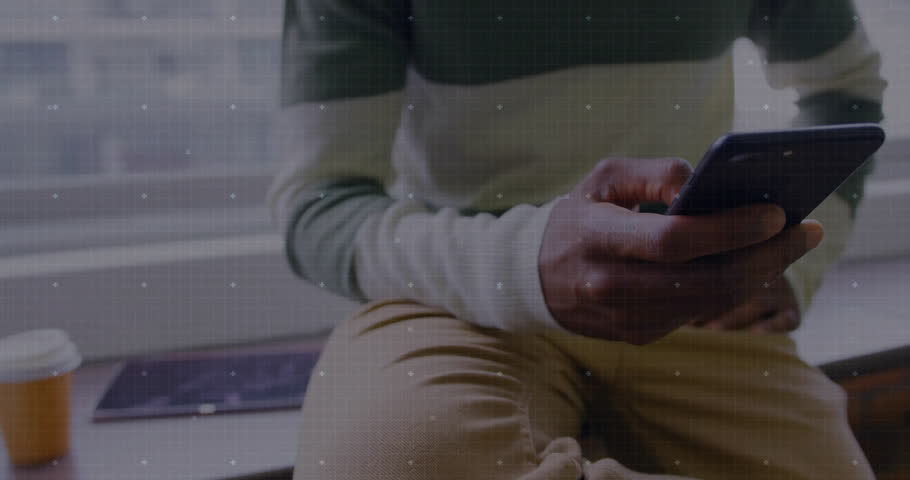 Man tapping phone and running business analytics with spinning HUD rising bar line graph overlays. Technology, data, analytics, innovation, finance, professionalism, modern