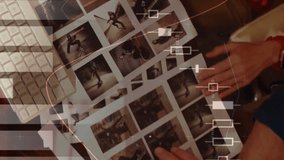 Digital composite of Caucasian man and woman discussing photos in while using a computer and drinking coffee 4k - Powered by Shutterstock - Get 15% off with code: PIKWIZARD15