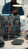 Vertical Video Employees sharing ideas on a web video conference call at the workstation, discussing about project briefing with charts and reports. Business associates attending online meeting event - Powered by Shutterstock - Get 15% off with code: PIKWIZARD15