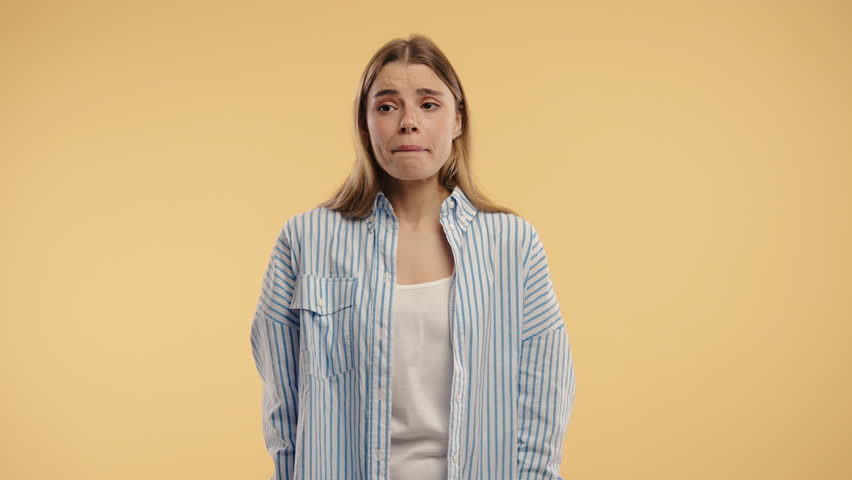 Confused blonde woman shrugs shoulders showing uncertainty, confusion,hesitation