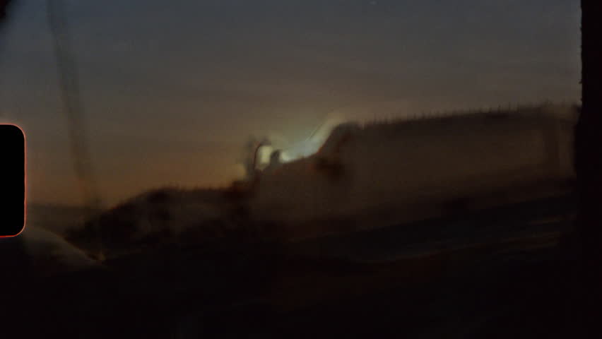 Super 8mm film of California coast life, sunsets, surfing, golden retrievers, palm trees, and beach scenes in warm, nostalgic analog tones.