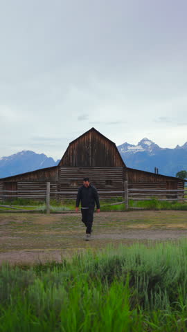 Experience the breathtaking and stunning beauty of the iconic John Moulton Barn, which is glowing beautifully at sunrise in the picturesque, scenic Grand Teton National Park, located in Wyoming