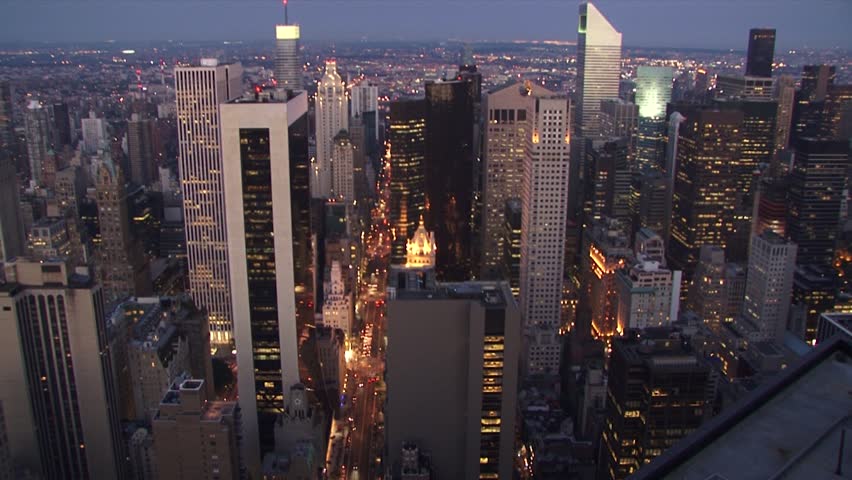 New york city skyline at twilight, showcasing bright city lights, aerial view