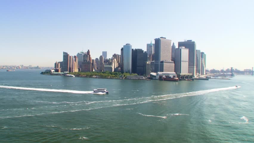 Beautiful aerial view of New York's skyline with a boat in the foreground