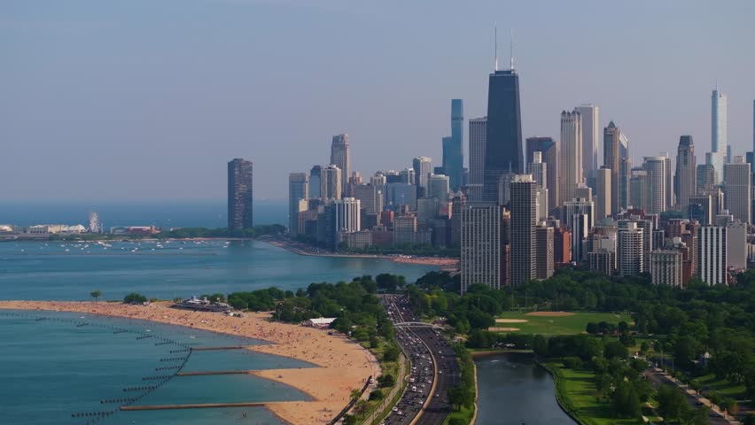 Tight Aerial View of Chicago Skyline, North Avenue Beach, Lake Michigan. Descending Drone Shot