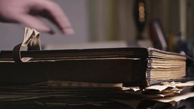 Academic researcher places aged archival documents into worn folders - Powered by Shutterstock - Get 15% off with code: PIKWIZARD15