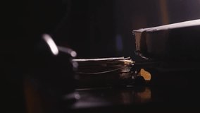 Side shot reveals mystery man collecting documents from moody lit desk - Powered by Shutterstock - Get 15% off with code: PIKWIZARD15