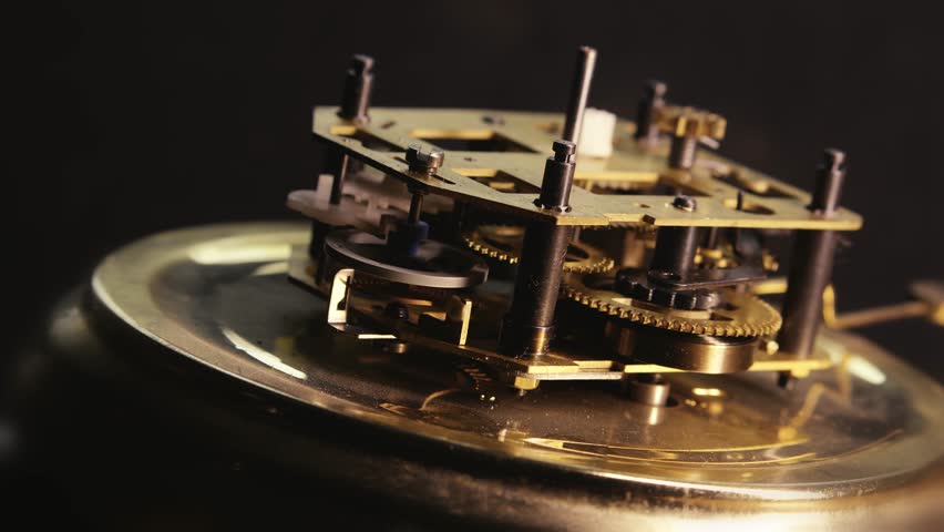 Wind up Clock internal mechanism movement oscillating in rhythmic time