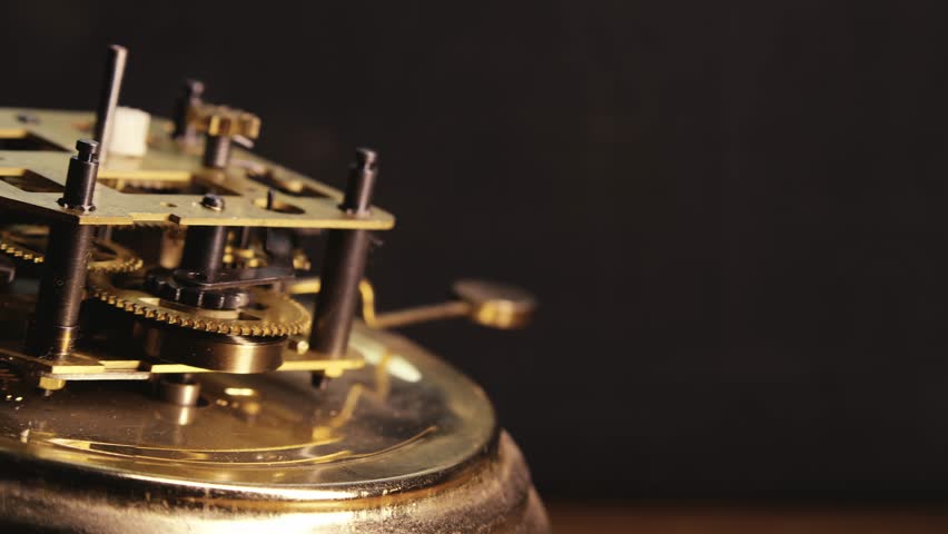 Slide macro shot reveals Brass clock internal mechanical movement